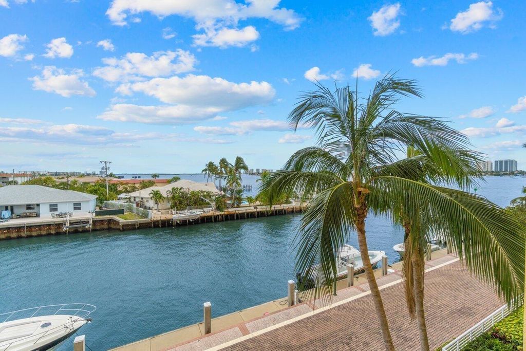 Photo of 2650 Lake Shore Drive #302, Riviera Beach, FL 33404 (MLS # R11169738)