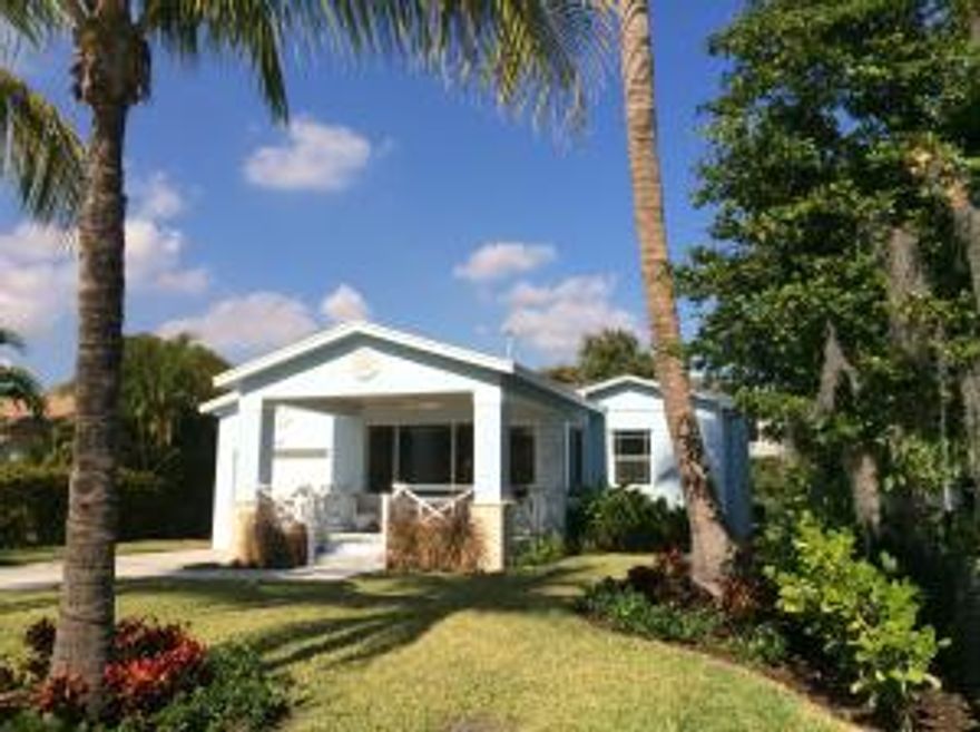 Prestigious E. Lakewood Road breathtaking renovation.  This fantastic 3 bedroom, 2 bath home has been fully renovated to perfection. A fabulous front porch in the Craftsman style is a generous size and sets the stage for the phenomenal interior. An open concept enhanced by perfectly finished sparkling wood floors throughout includes numerous features. Sophisticated finishes are: deluxe crown moldings, custom wood doors and trim, recessed lighting, high ceilings, impact windows and more! This home has been essentially rebuilt from the exterior walls to new, new, new. All electrical wiring, plumbing, sewer lines, and fixtures have been replaced! The custom kitchen has wood cabinets, quartzite ocean blue counter tops, stainless appliances and gas burner cooktop. This house is a HOME!!!!