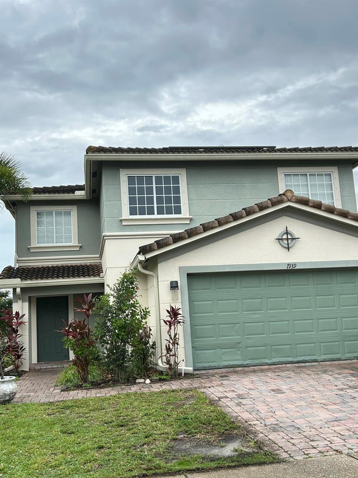 Discover this stunning 2-story single family home featuring 4 spacious bedrooms and 2.5 baths. With a BRAND - NEW TITLE ROOF and the added advantage of Solar Panels for energy efficiency.Located in a desirable Newport Isles gated community.Conveniently located near 95 and Tradition shops, this home is perfect for those who appreciate both comfort and accessibility. Enjoy the beautiful lake views from your backyard, making this property a true gem.