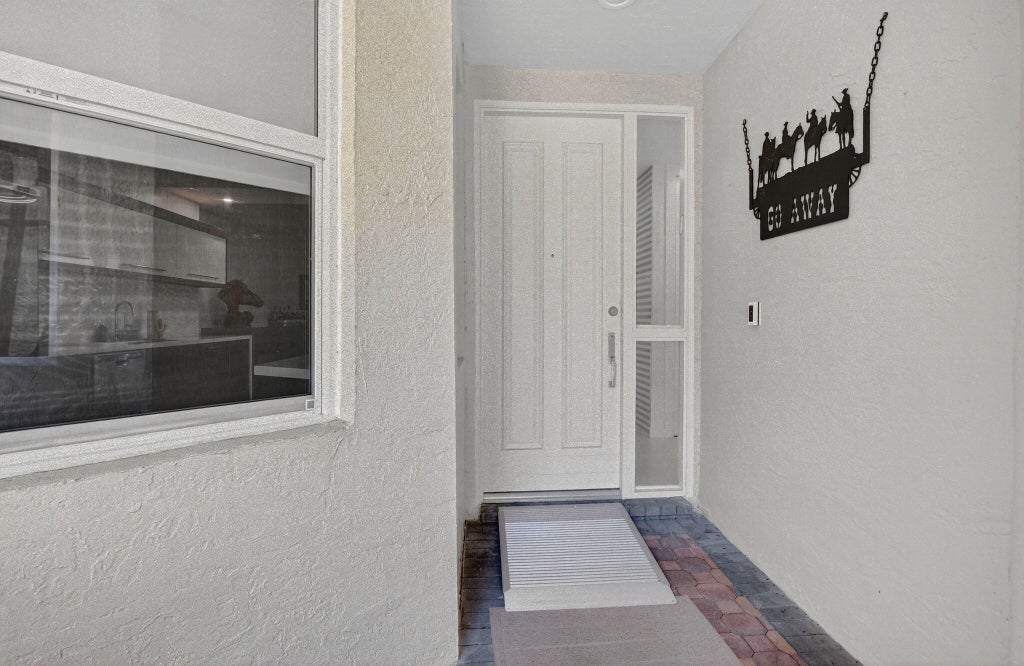 Photo of 2584 Coco Plum Blvd #104, Boca Raton, FL 33496 (MLS # B26093138)