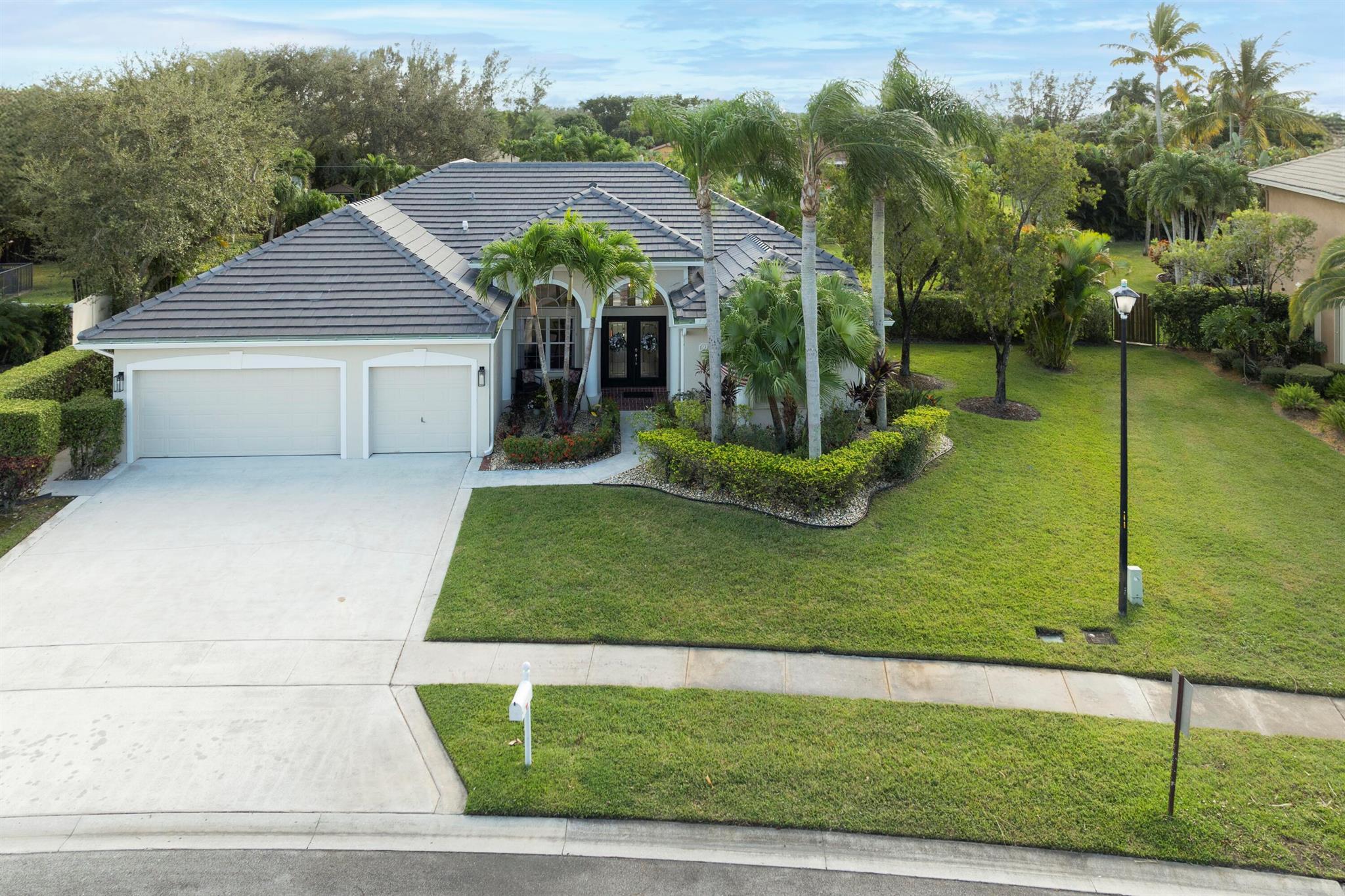 Situated in popular Cypress Lake Estates, this classic 4 br/3 bath/3c gar,home is ready for its new family. Very neutral in color choices, one gets a serene feeling when opening the entry's leaded glass double doors, & Palladium windows bring in the light! French doors from LR, fam rm. & primary Bedroom open to the screened porch, 30'x 20' pool, spa, & patio oasis. A covered grille area and large grassy area for playing add to the many places to relax and have fun. This home has been meticulously updated with traditional and timeless finishes: New tile roof, new LVP floor in most of home,recently painted exterior and interior. The bathrooms have new quartz topped vanities with stunning fixtures. Convenient 3 way split plan gives everyone a place to enjoy. Check out the documents for more!