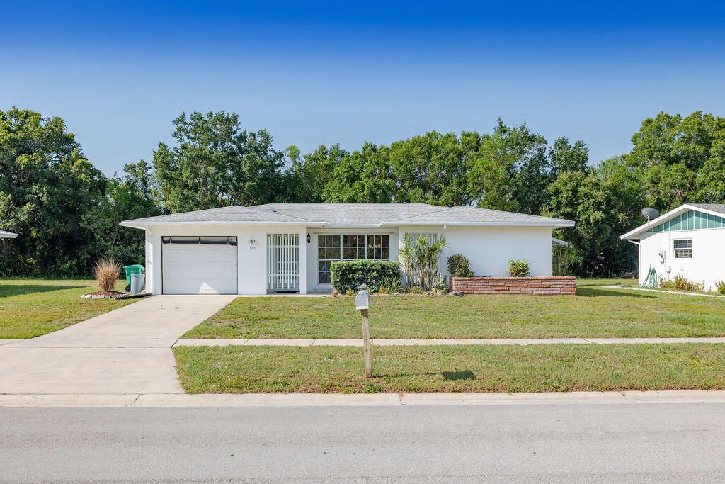 Photo of 300 NE Solida Drive, Port Saint Lucie, FL 34983 (MLS # R10799990)