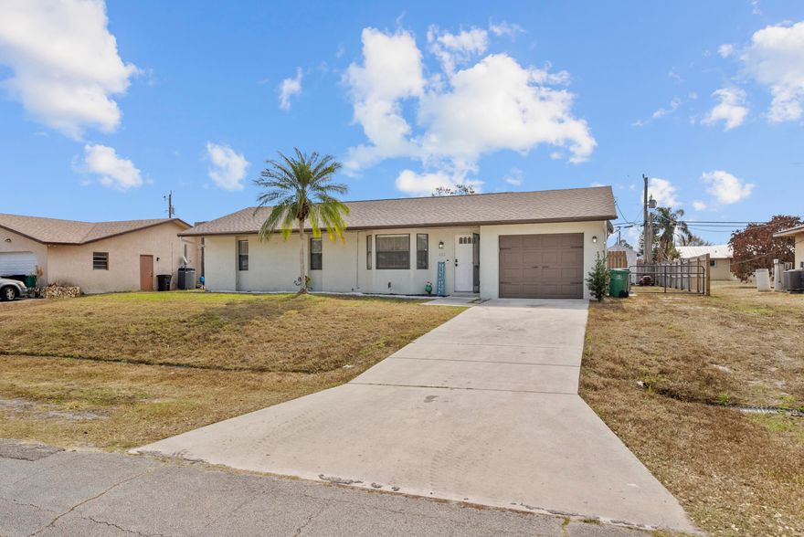 Welcome to 822 SW Harvard Rd in the Palm Trails area of Port St. Lucie. This 3 bed, 2 bath, 1 car garage home features vaulted ceilings, new LVP flooring in the main living areas, and a BRAND NEW 2025 roof. The kitchen features updated appliances and master bathroom has also recently been updated. Enjoy a covered patio overlooking a large, fully fenced backyard with plenty of room for a pool or outdoor entertaining. Conveniently located near shopping, dining, I-95, and nearby parks including Oak Hammock Park and Jessica Clinton Park, plus a short drive to beaches and waterfront attractions along the Treasure Coast. Go east to the beach or west to Traditions all under 15 min.