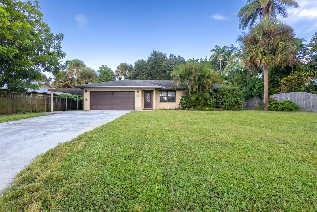 Photo of 1008 NE Kubin Avenue, Jensen Beach, FL 34957 (MLS # R11017007)
