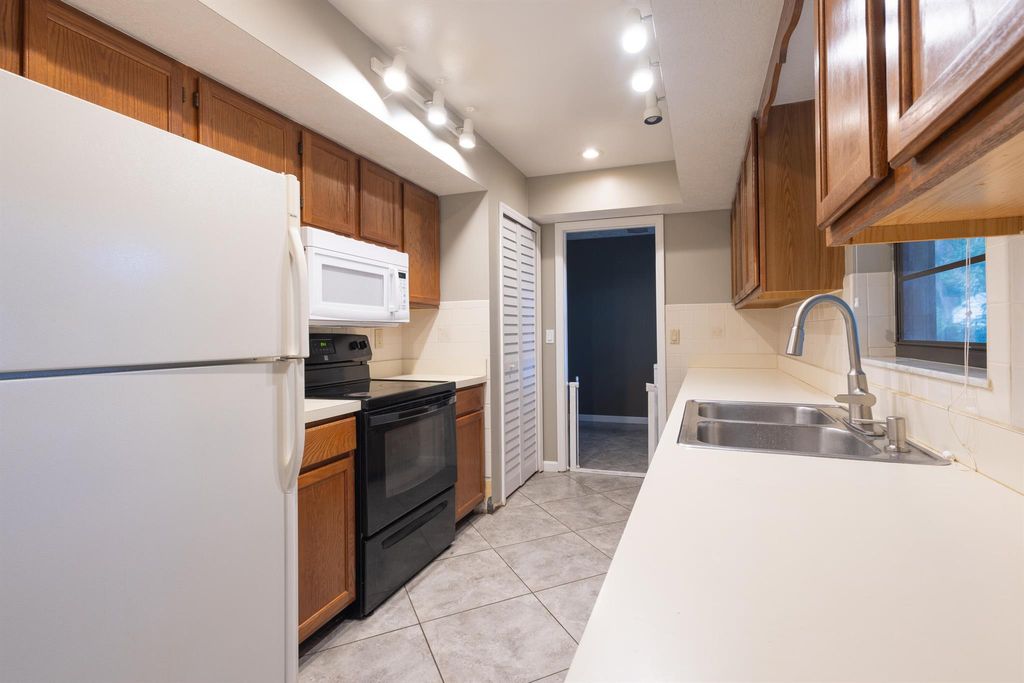 Photo of 1008 NE Kubin Avenue, Jensen Beach, FL 34957 (MLS # R11017007)
