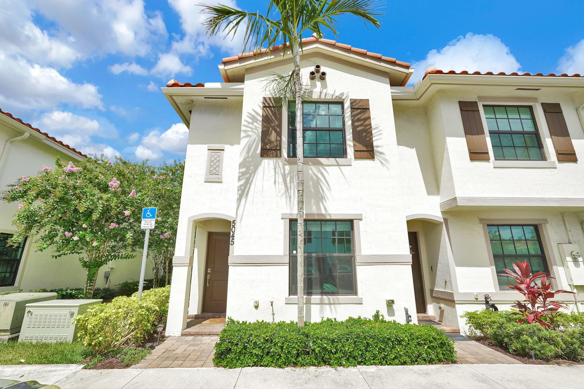 Modern & Immaculate CORNER Townhouse is in a gated community, minutes from I-95, Palm Beach Gardens PBI airport and shopping. This move-in-ready home offers a perfect open-air floor plan with a spacious living room and dining room area with natural light throughout. A first-floor bedroom with a full bath, plus 2 bed/2 bath upstairs. The spacious primary suite offers dual vanities and a glass-enclosed shower, while an additional loft/den area provides flexible living space.The home is fitted with hurricane impact windows and a brand-new 2021 roof, private storage and assigned parking space. Low HOA fees and the ability to lease immediately add to its appeal. The stylish community offers resort-style amenities including a swimming pool, fitness center, and more. Motivated Seller!