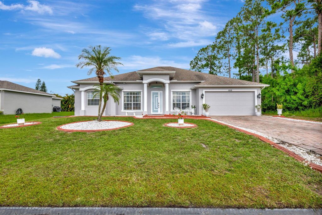 Photo of 1958 SW Del Rio Boulevard, Port Saint Lucie, FL 34953 (MLS # R11137457)