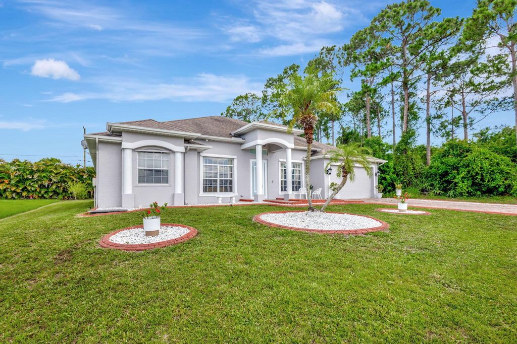 Photo of 1958 SW Del Rio Boulevard, Port Saint Lucie, FL 34953 (MLS # R11137457)