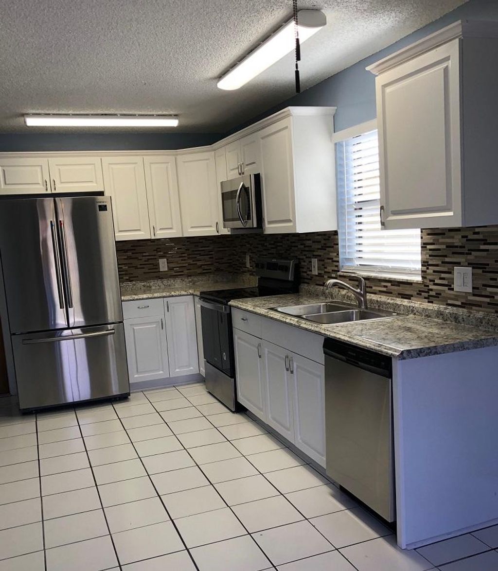 Photo of 5890 SE Wilsie Drive SE, Stuart, FL 34997 (MLS # R11160709)