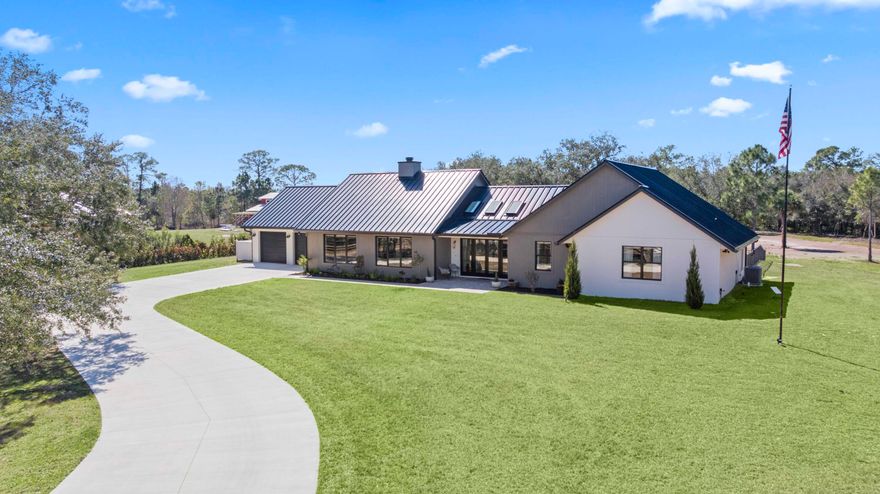 This rare, tranquil custom estate offers  a blend of  country living and sophisticated  lifestyle in a healthy natural, spa inspired setting.  Located in the highly sought out Bridlewood Ranches, a  private, gated equestrian community, this exquisite  4 bedrooms/2 full 2 half bathroom luxury home was built in 2024. It is Located on 5+ acres on a cul de sac and was built with intention by owners,  showcasing exceptional craftsmanship and attention to detail. Features include a standing-seam metal roof, oversized garage, hurricane-impact windows and doors and a stunning kitchen with 11' island and smart home functionality. The fully  equipped,  mirrored gym features  professional equipment with seamless  outdoor spaces including heated pool, integrated spa, and outdoor 6 person sauna/wet area. Elevated finishes throughout with soaring tray ceilings designed with cypress beams.  Multiple French doors and expansive windows provide a calming  flow from luxurious inside amenities to the natural outdoor spa area.  Privacy, beauty and lifestyle in one exceptional home surrounded by abounding nature. The home is offered partially furnished, personal items and artwork not included. Many items and decor negotiable.