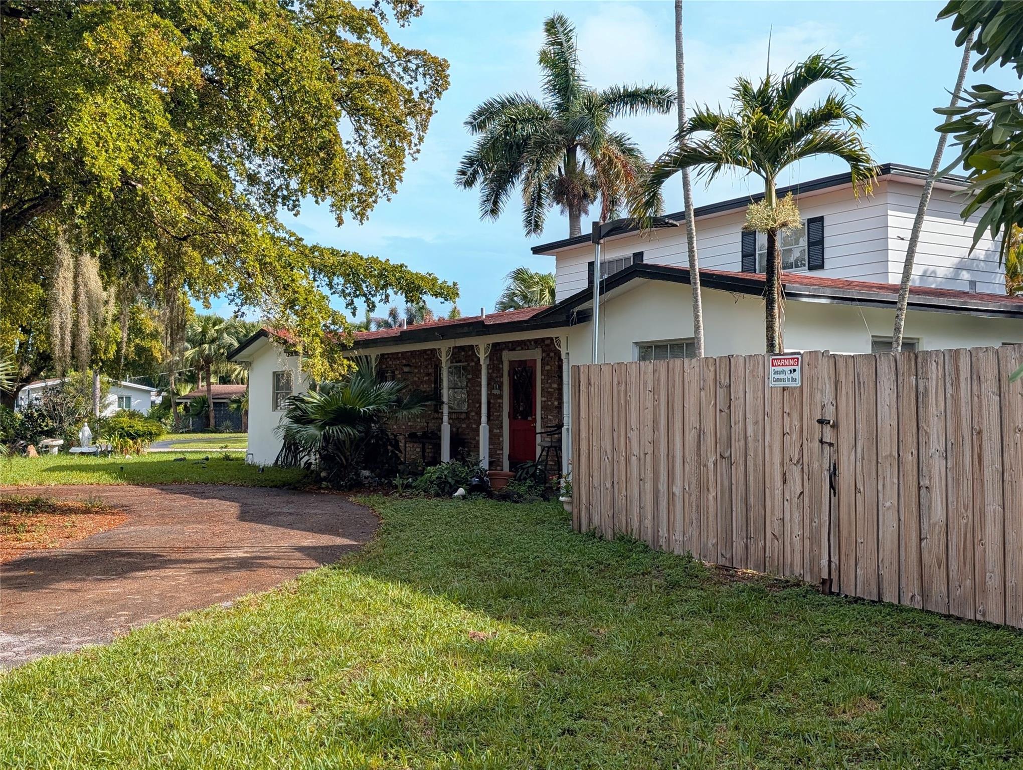 Bring your vision to this unique 4-bed & 3-bath, 2-story 1,900+ sq. ft. home on a spacious 10,000 sq. ft. corner lot in Oakland Park's desirable Lloyd Estates. Main floor features a primary bedroom, 2-guest bedrooms, kitchen, family room & dining room that leads to a screened-in porch. On the 2nd floor, you'll find a large bedroom with en-suite bathroom & walk-in closet. Enjoy backyard privacy with a 6-ft. fence surrounding the property. Property offers a 1-car garage & two driveways that include a circular driveway in front. You'll appreciate the covered front porch while overlooking the yard & large Royal Palm tree. Home is equipped with landscape lighting, security lighting & sprinkler system. Additional features include laundry room, 2-A/C units, & new refrigerator, range & dishwasher.