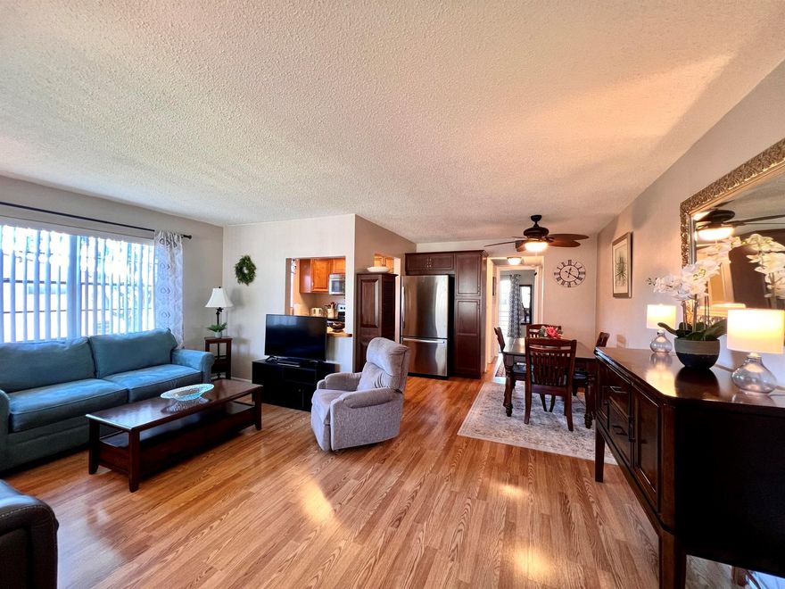 Beautiful & Move-in Ready In 55+ Century Village! Elegantly Updated & Meticulously Maintained CORNER 1/1.5 Floor Plan. Pretty Updated Kitchen With Expanse of Cabinets & Stainless Appliances. Updated Baths. Pretty Bedroom Suite With Updated En-Suite Bath With Tub/Shower, Wall of Closets, and Access to the Lanai. Lovely Long Screened Lanai Is A Delightful Spot To Take in The Garden Views & Breezes. Central AC (2023). Pretty Wood Look Laminate Flooring Throughout. Sold With Tasteful Lightly Used Furniture & Some Contents.  Canterbury D Features A Pretty Resident Patio With Grill and Second Floor Laundry. Century Village is a 55+ Resort Style Community With So Much to Offer... - shows, movies, clubs, pools, security, and transportation service. The Clubhouse features a theater, indoor pool, card room, community/party room, billiard room, shuffleboard, tennis, pickleball, bocce, and two outdoor pools, Numerous heated outdoor pools throughout the community. Separate fitness center with gym and outdoor heated pool & resistance pool. Two guarded gates and 24-hour roving security patrol.