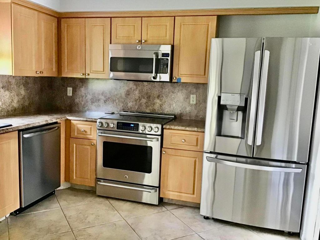 Photo of 9840 Clusia Tree Drive #A, Boynton Beach, FL 33436 (MLS # B26012009)