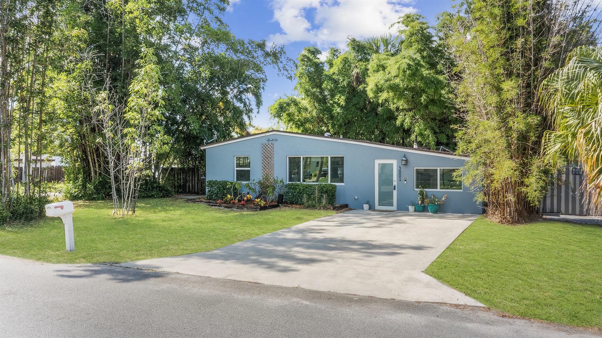 Charming Corner-Lot Home. This inviting 2-bedroom, 1-bath residence sits on a desirable corner lot with NO HOA. Enjoy the peace of mind that comes with a solid CBS home boasting a new 2020 roof, new 2024 AC, impact glass, brand new 2025 washer dryer, plus the new drain field and lift tank installed in 2021. Enjoy a spacious screened-in back patio for entertaining. The fully fenced backyard comes complete with a large storage shed, outdoor shower and mature bamboo plants. The converted garage provides a flexible space that could become a third bedroom, while the laundry room presents an opportunity to add a second bathroom in the future. The yard may accommodate boat storage with landscaping changes. This well-maintained home is a wonderful blend of functionality and comfort.