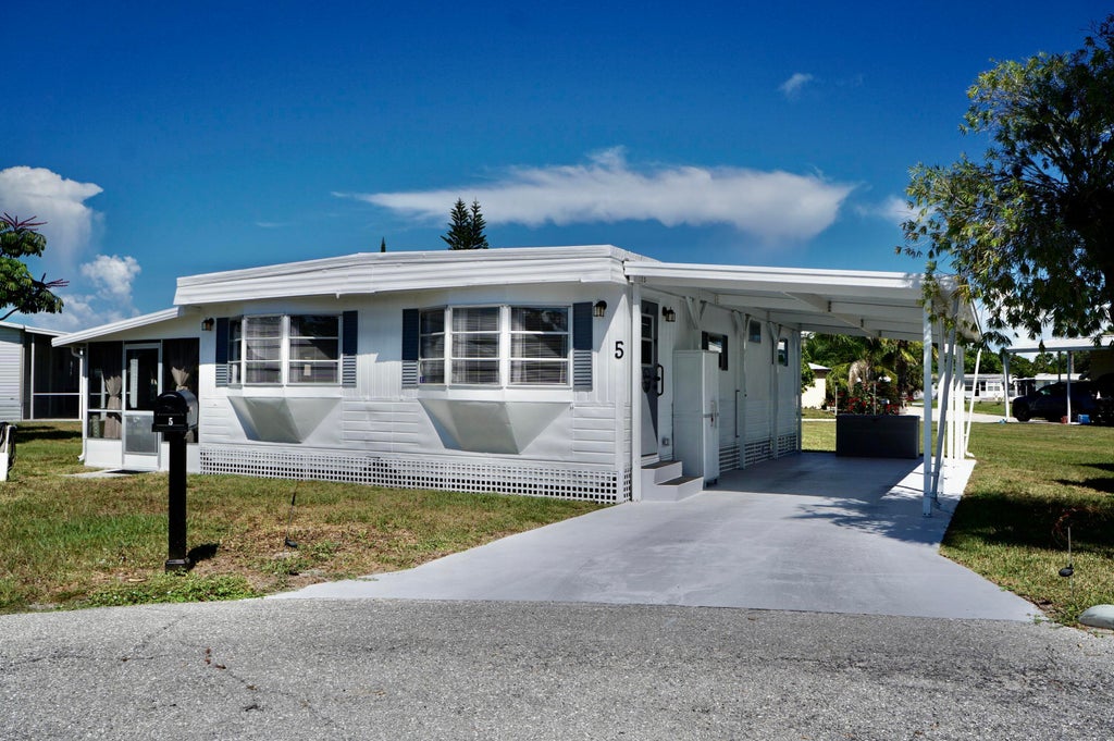 Photo of 5 Ventura Lane, Port Saint Lucie, FL 34952 (MLS # R11117176)