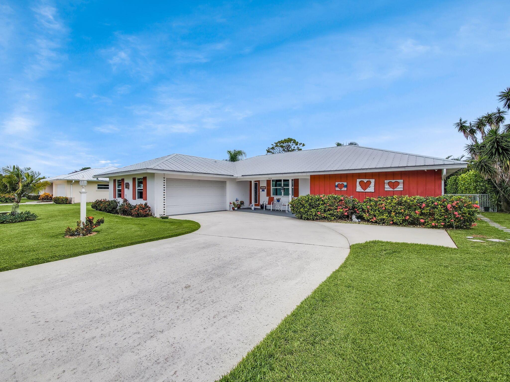 Beautifully renovated 3 bed, 2 bath home with a 2-car garage and a 2018 sunroom, located in the desirable 55+ community of Little Club. This home showcases impact windows (2017), solid wood doors, crown molding, and 18'' tile flooring throughout. The spacious, open kitchen boasts a large island, Curava recycled glass countertops, stainless steel appliances, white wood cabinetry, and stylish modern finishes. Both bathrooms have been tastefully updated, and the home offers abundant closet space for convenience. Step outside to enjoy the expansive tropical yard with two patios, both enhanced by pergolas and remote-controlled awnings. Additional upgrades include a 22kw generator with 750-gallon gas tank, water softener and reverse osmosis system, outdoor shower, epoxy garage flooring,