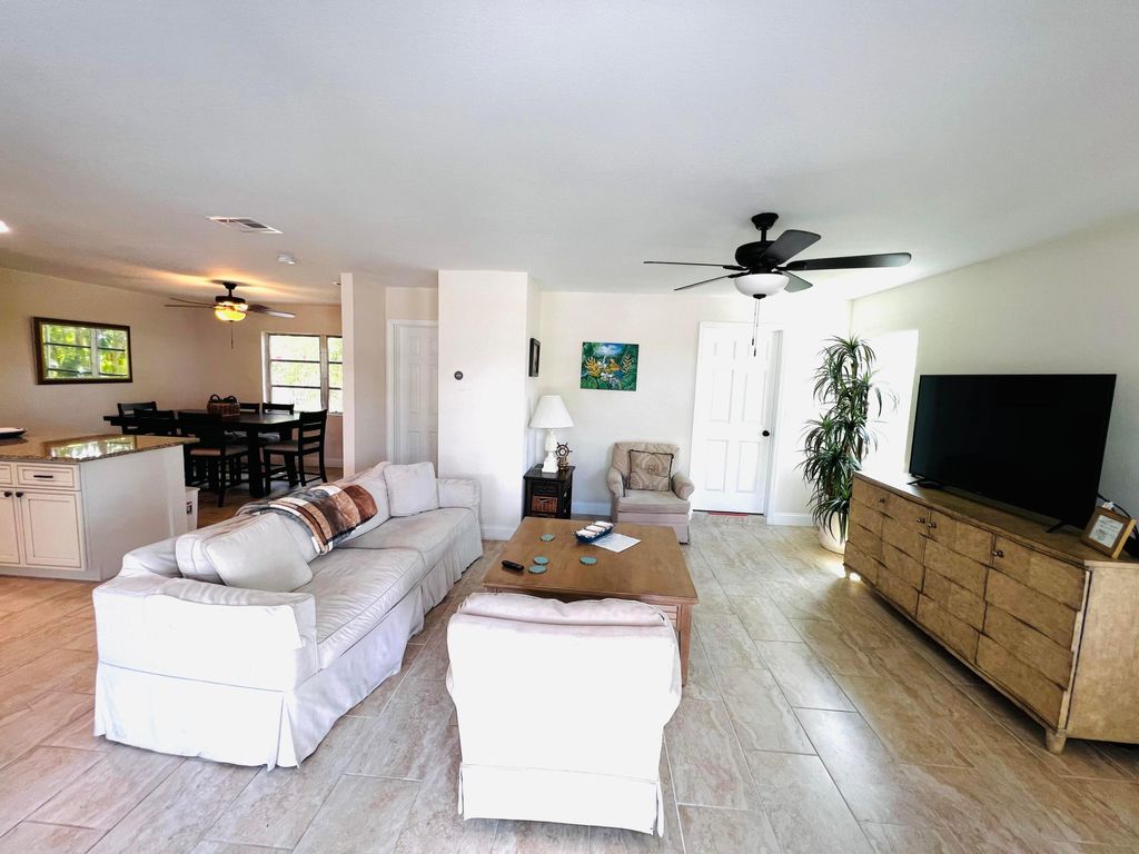 Photo of 2941 SE Treasure Island Road, Port Saint Lucie, FL 34952 (MLS # R10985765)