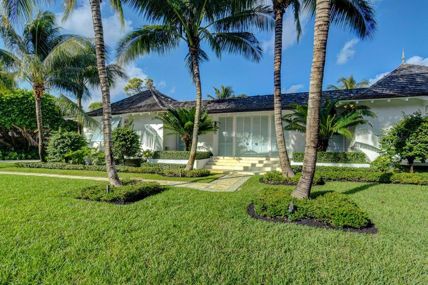 One of the most architecturally interesting and pleasing homes in The Village of Golf. Inspired by the homes in The Tryall Club in Jamaica this house perfectly blends the outside with the inside resulting in Florida living at its very best. Wonderful golf course views of the 12th  green and 13th hole. The entrance is through large double louvre doors to a magical lanai with fountain, pool and a 2/2 Guest House with living room. You will not be disappointed except when it is time to go.