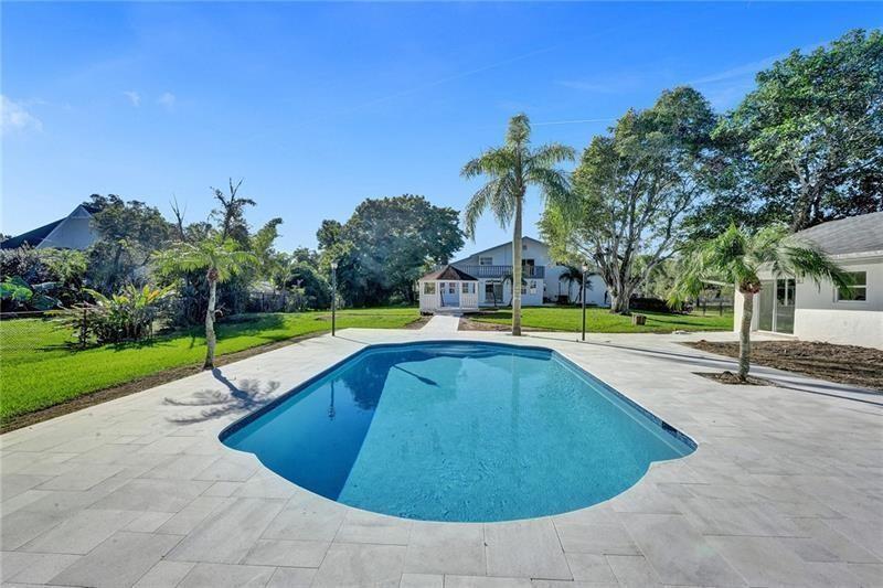 RARE AND AMAZING OPPORTUNITY TO OWN TWO HOMES ON AN ACRE LOT! LOCATED IN THE DESIRABLE PLANTATION ACRES NEIGHBORHOOD! MAIN HOUSE IS 4 BEDROOMS + 3 FULL BATHS! THREE BEDROOMS LOCATED UPSTAIRS + ADDITIONAL SPACIOUS GUEST ROOM AND FULL BATH DOWNSTAIRS! MASTER HAS HUGE PRIVATE BALCONY/TANNING DECK, WALK-IN CLOSET & MASTER BATH! TWO-CAR GARAGE, BEAUTIFUL BACK PATIO EQUIPPED WITH CEILING FANS! WALK OUT TO YOUR PRIVATE GAZEBO & PRISTINE POOL! GUEST HOUSE FEATURES 2 BEDS/2 BATHS 1600SF WITH FULL KITCHEN! BRAND NEW PAVERS & NEW WATER HEATER! NO HOA! LIVESTOCK ALLOWED AND WELCOME! HUGE LAWN, FULLY FENCED WITH PLENTY OF GARDENING SPACE OR ROOM TO EXPAND DRIVEWAY! WALKING DISTANCE FROM AMERICAN HERITAGE, CLOSE TO MAIN HIGHWAYS , SAWGRASS MALL, HOUSES OF WORSHIP AND SO MUCH MORE!