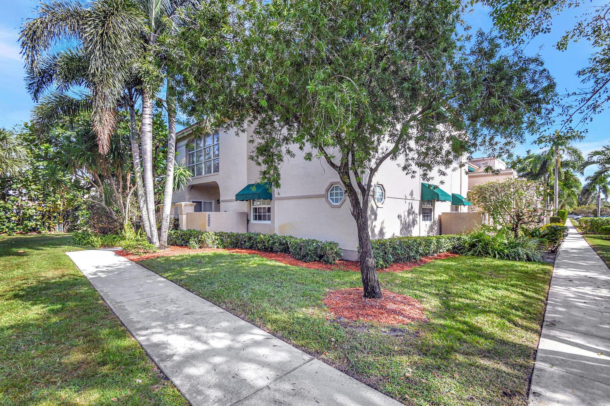 Experience luxury living in this fully renovated 2-bedroom, 2-bath first-floor condo in Plum at Boca Pointe. Every detail has been redone to perfection, creating a truly move-in-ready home. Beautiful wood floors flow throughout, and all windows and doors have been upgraded to impact glass. Brand new A/C !!! The courtyard entrance features an open patio and storage area, while the enclosed patio offers additional living space with peaceful garden views. The kitchen boasts quartz countertops, white cabinets, stainless steel appliances, and a French door fridge. Smooth ceilings, crown molding, updated bathrooms, custom walk-in closets, and a front-loading washer and dryer add to the appeal. Furniture is negotiable--don't miss this rare gem!