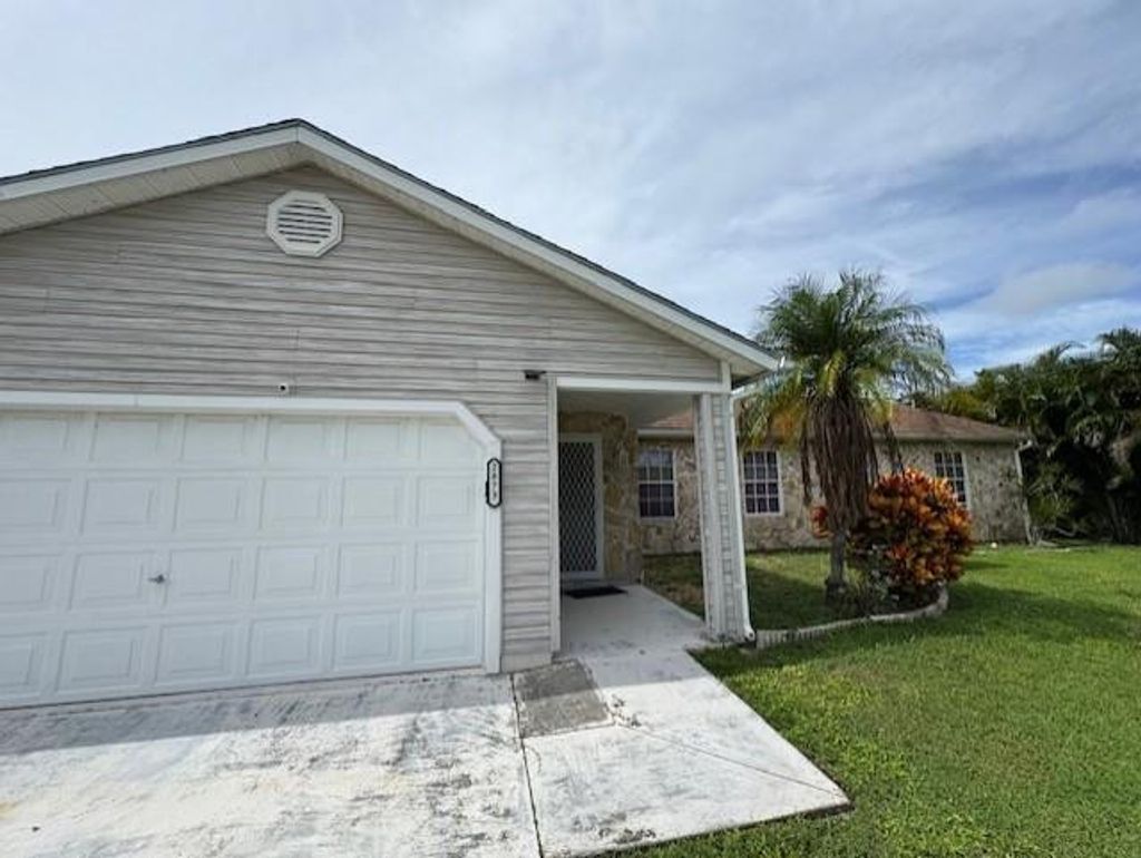 Photo of 2873 SE Rawlings Road, Port Saint Lucie, FL 34952 (MLS # F10530592)