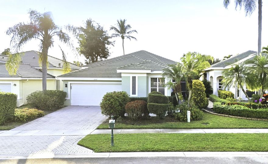 Experience elevated country club living in the prestigious Aberdeen Golf and Country Club. This 3-bedroom, 2.5-bath home is your opportunity to enjoy an unrivaled blend of recreation, relaxation, and community in one of South Florida's premier private country club settings. Step inside to discover an inviting open floorplan with vaulted ceilings and abundant natural light, creating a bright and airy atmosphere. The spacious family room, attached florida room, and screened patio offer indoor outdoor living while overlooking the home's lush, beautifully manicured landscaping. The large kitchen and open floorplan provide plenty of space for cooking, dining, relaxing or entertaining. Recent upgrades include a 2019 roof and 2024 A/C providing peace of mind. The Aberdeen lifestyle is truly