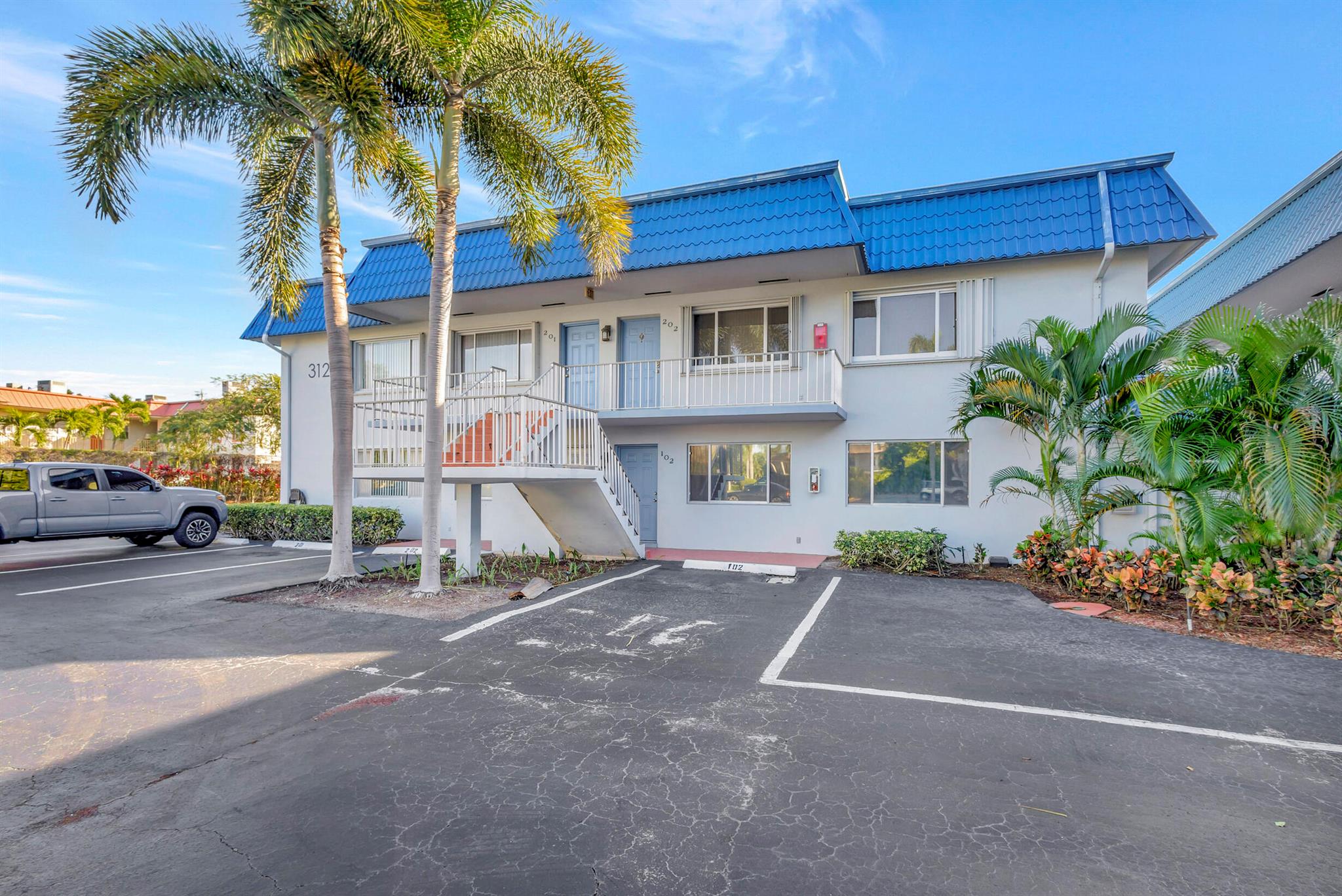 Discover the comfort and convenience of this 2-bedroom, 2-bathroom condo in the Village of North Palm Beach. Located on the 2nd floor, this well-maintained unit offers a simple and inviting living space. Inside, you'll find tile and vinyl flooring. The kitchen is equipped with SS appliances and granite countertops. The primary bedroom comes with a walk-in closet and a private balcony, perfect for quiet moments. Recent upgrades include a new washer and dryer, roof and A/C unit for your peace of mind. Impact glass windows add an extra layer of security.While the condo itself isn't waterfront, the community offers a waterfront deck and a barbecue grill, ideal for outdoor gatherings. The Village of North Palm Beach provides a friendly atmosphere with easy access to local amenities.