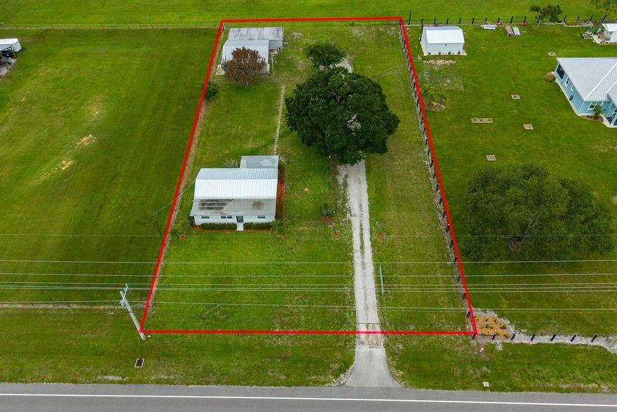 Offering 3.75% Rate** Recently renovated 3-bedroom, 2-bath home- JUST SHY OF 1 ACRE -in a desirable Vero Beach location, just minutes from the beach, shopping, dining, and everyday conveniences. Recent upgrades include a 2025 metal roof, all-new PEX plumbing, impact windows, and two new A/C systems. The updated kitchen features beautiful cherry cabinetry and stainless steel appliances. Situated on a fenced property, the standout feature is the impressive 60' x 57' barn/garage/workshop complete with an air-conditioned office or mother-in-law suite, plus a utility shed. Ideal for car enthusiasts, contractors, hobbyists, RV and boat owners, or anyone needing exceptional storage and workspace. Move-in ready with endless possibilities. NO HOA ***One or more photos are altered to remove item ** 3.75 % interest rate being offered with our preferred lender     Vero Beach Gem with Massive Barn, Modern Upgrades & Endless Possibilities!    Welcome to this beautifully renovated 3-bedroom, 2-bathroom home ideally located in one of Vero Beach's most desirable areas—just minutes from the beach, shopping, dining, and everyday conveniences!    This move-in-ready property has been extensively updated with a 2025 metal roof, all-new PEX plumbing, impact-resistant windows, and two new A/C systems for peace of mind and energy efficiency. The heart of the home features stunning cherry wood kitchen cabinetry, sleek stainless steel appliances, and modern finishes throughout.  Step outside to discover a rare and incredible bonus—a 60' x 57' barn/garage/workshop complete with an air-conditioned office or mother-in-law suite, offering endless opportunities for a home business, hobby space, storage, guest accommodations, or the ultimate workshop. A separate utility shed and fully fenced yard provide even more functionality and privacy.  Bring your boats, RVs, classic cars, tools, and toys—there's room for it all!     Whether you're seeking a private homestead, a hobbyist's paradise, or a property with exceptional workspace, this unique Vero Beach offering delivers.    Close to Vero's beautiful beaches, shopping centers, restaurants, parks, and top local amenities.  Don't miss this one-of-a-kind opportunity to own a fully updated home with unmatched storage and workspace in the heart of Vero Beach!