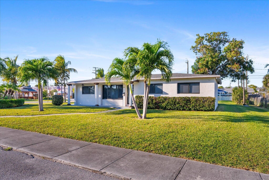 Photo of 651 Foresteria Drive, Lake Park, FL 33403 (MLS # B26070475)