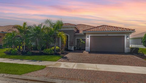 Photo of 11192 SW Maple Tree Lane, Port Saint Lucie, FL 34987 (MLS # B26007314)