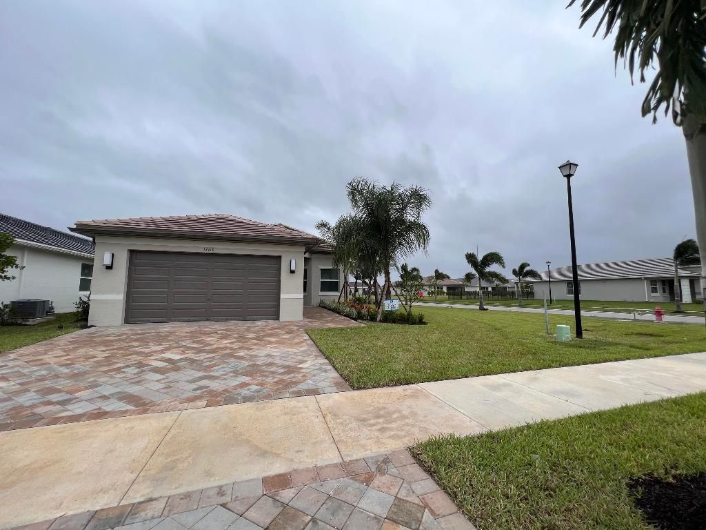 Photo of 13419 SW River Rock Road, Port Saint Lucie, FL 34987 (MLS # R10940350)