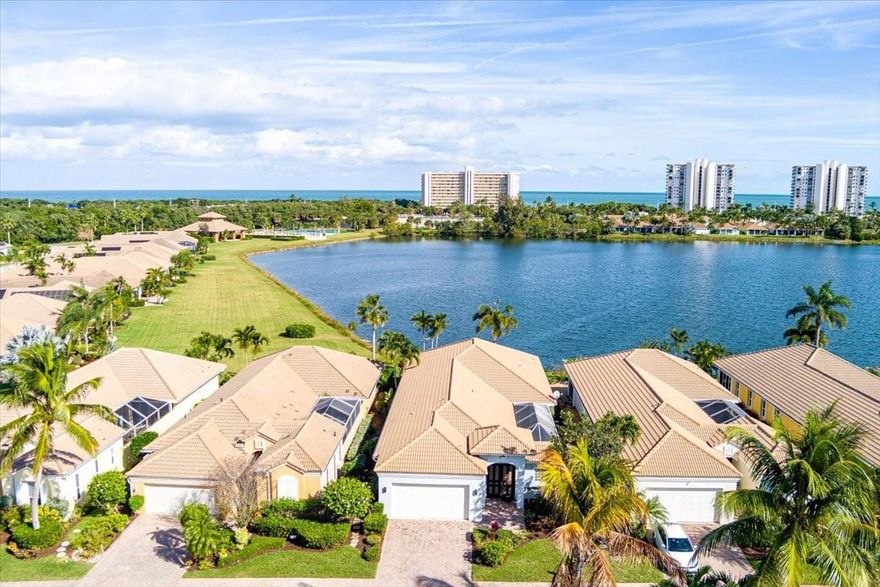 Experience the ultimate coastal lifestyle in this stunning 3BR/3.5BA courtyard pool home, perfectly situated on an extended lot just steps from Pepper Park, the Navy SEAL Museum, and private beach access. This unique property offers a rare blend of river and ocean living with available boat slips and a private walkway leading directly to the sand. The heart of the home is a secluded, screened-in courtyard featuring a private pool, summer kitchen, outdoor shower, and a dedicated pool bath, making it an entertainer's dream. Inside, the residence exudes elegance with volume ceilings, crown molding, tile flooring, and plantation shutters throughout The light-filled great room offers peaceful lake views, while the updated chef’s kitchen features granite countertops, stainless steel appliances, and a spacious walk-in pantry. The primary suite serves as a private retreat with direct lanai access, and the guest bedrooms are thoughtfully designed with their own entrances to the courtyard oasis. Sitting on a larger lot with added green space, this home provides a sense of privacy and tranquility rarely found in beachside communities. Additional features include accordion shutters for peace of mind and a prime location that balances luxury with Florida’s natural beauty.