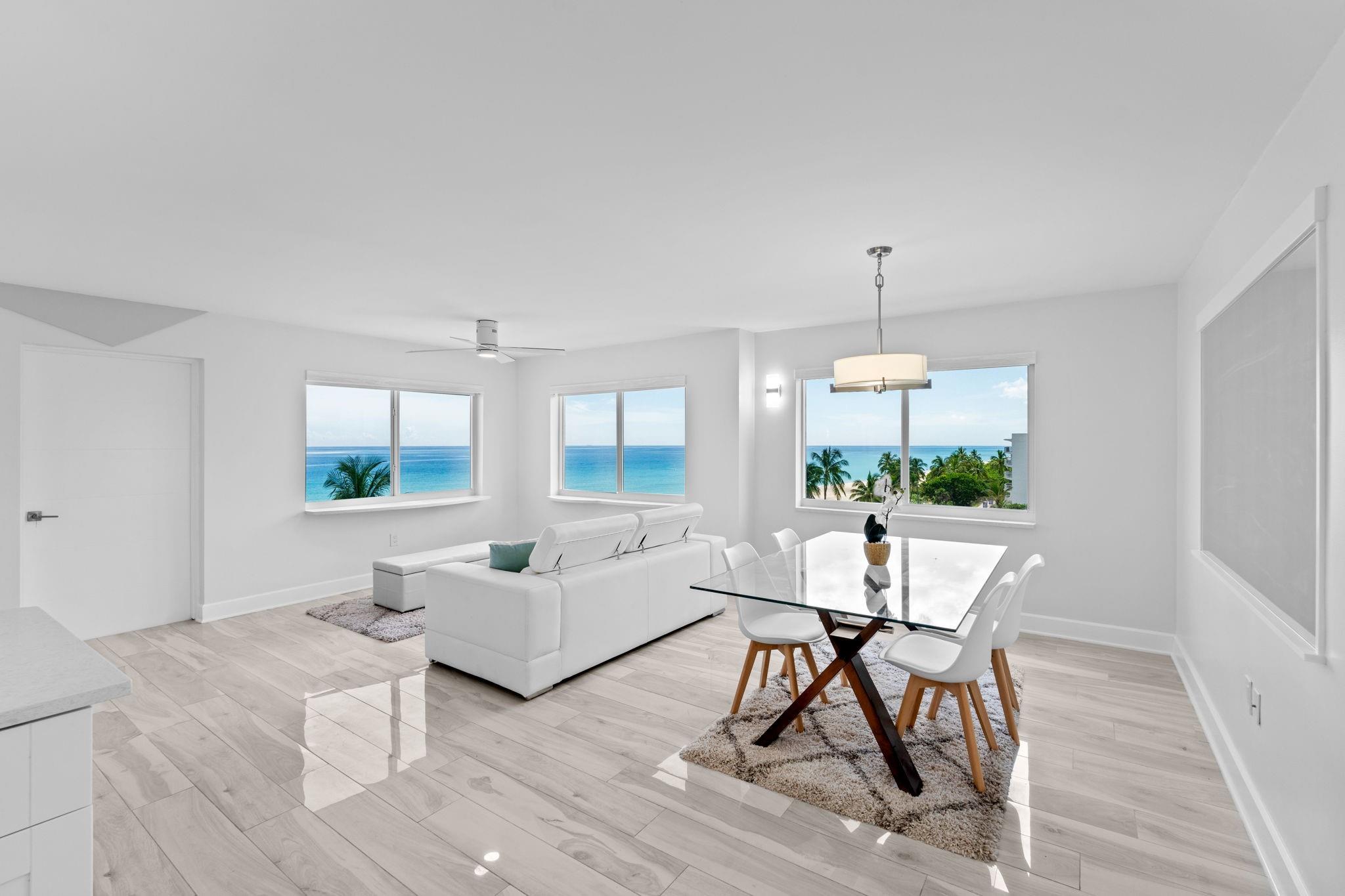 Experience boutique coastal living in this fully renovated 2BR residence within an Art Deco–inspired 6-story condo directly on the oceanfront and Hollywood Broadwalk. Enjoy sweeping views of the Atlantic to the east and Intracoastal to the west—one of the most coveted Boardwalk locations. Inside, light neutral finishes, Italian porcelain tile with soundproofing, and Level 5 ceilings create a modern, airy feel. Raised bulkheads add height, while the sleek kitchen features new appliances and an island cooktop with ocean views. Bathrooms are custom designed with high-end finishes, designer lighting, and unique mirrors. Additional upgrades include hurricane-impact windows and doors, motorized blinds, custom window seating, new ceiling fans, and washer/dryer hookup.