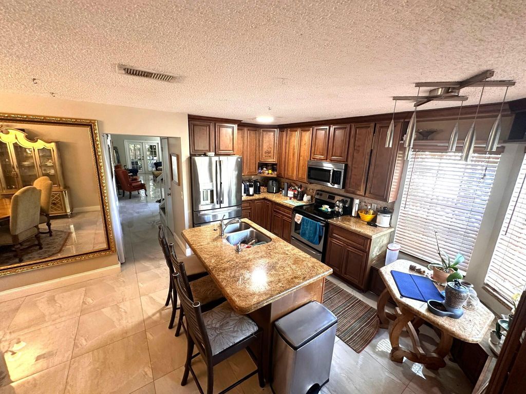 Photo of 5473 E Berry Blossom Way E, West Palm Beach, FL 33415 (MLS # R11093891)