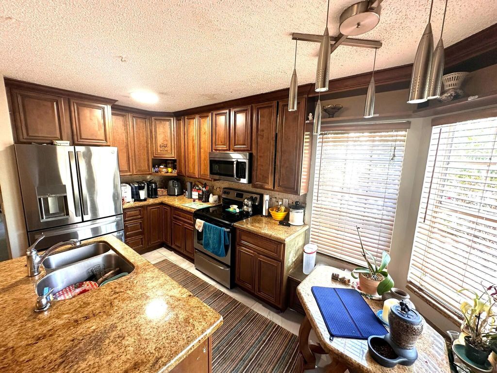 Photo of 5473 E Berry Blossom Way E, West Palm Beach, FL 33415 (MLS # R11093891)