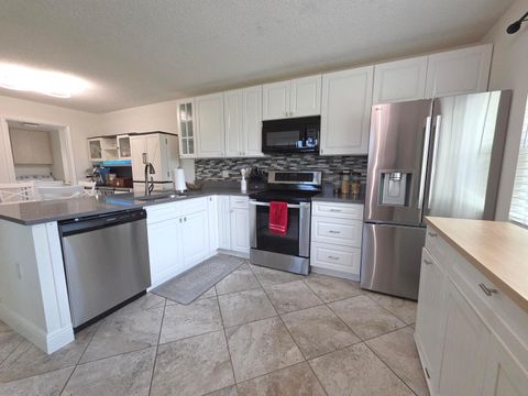 Photo of 3391 SW Sunset Trace Circle, Palm City, FL 34990 (MLS # B26040094)