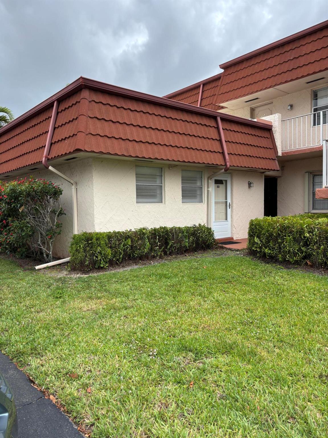 Stunningly remodeled, no expense spared in this first-floor single story unit. Adding to your convenience there is parking right in front of your door. TURNKEY completely and tastefully furnished with the lowest HOA dues in Greenway. Boasting a chef's kitchen with elongated white lacquered cabinets, independent island, stainless steel appliances and enrobed in quartz countertops.  Beautiful flooring throughout, built in cabinets, Bahama shutters on all windows and sliding doors.  this is truly a delight and has an enclosed patio. Location is extremely central right across from commons park which has a myriad of activities and free concerts. close to all shopping, little ranches and a few miles from the winter equestrian festival. 55+ community offering peace of mind and tons of amenities