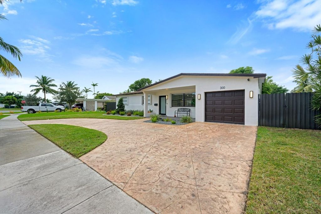 Photo of 300 SW 65th Way, Pembroke Pines, FL 33023 (MLS # F10537112)
