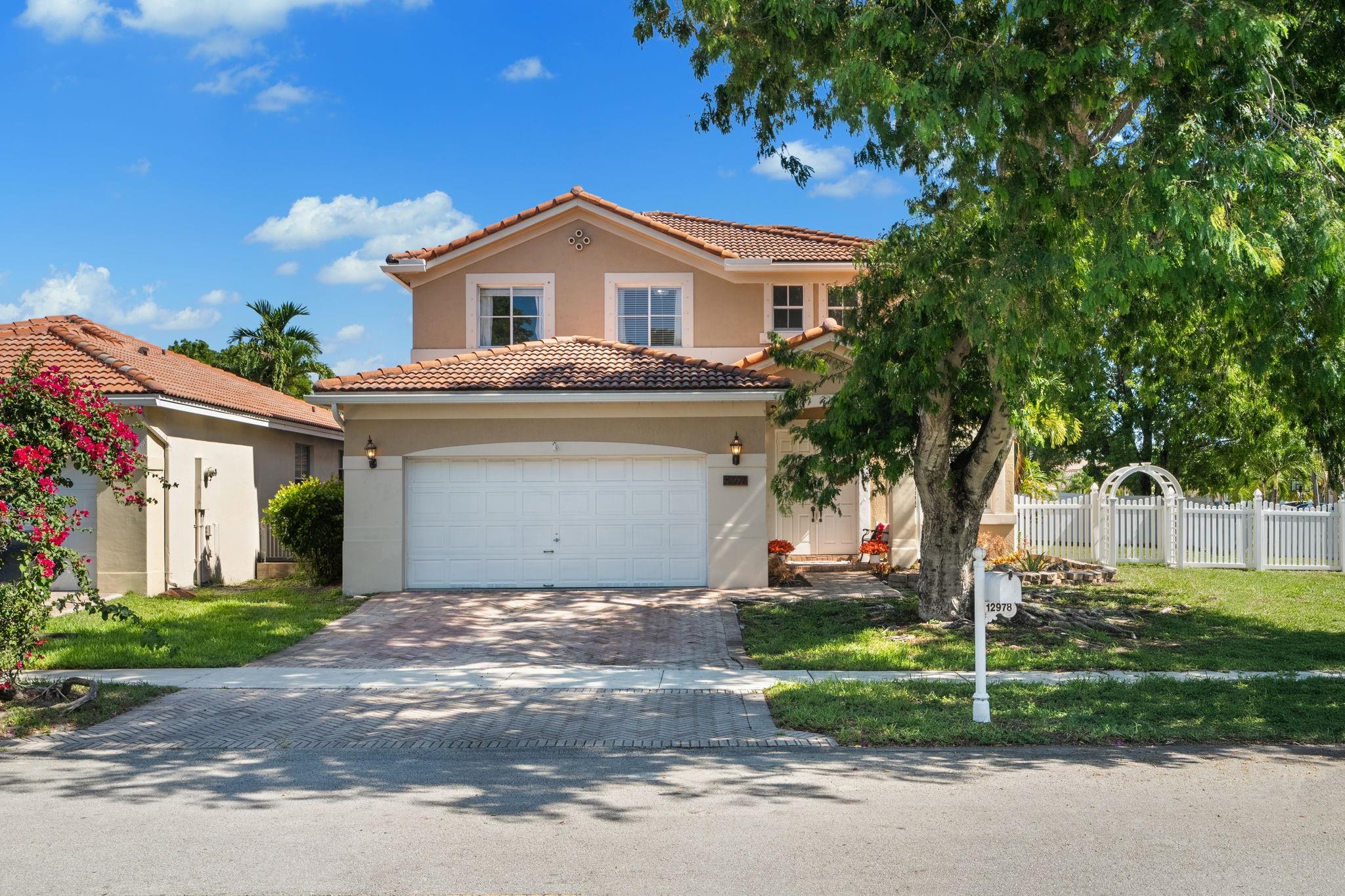 Beautifully updated 4-bed, 3-bath two-story home on one of the largest corner lots in Monarch Lakes. Features waterproof flooring, spacious family and dining areas, large kitchen with granite countertops, breakfast bar, stainless steel appliances, and eat-in nook. First-floor bedroom and full bath ideal for guests. Upstairs includes a primary suite with marble bath, custom closet, plus 2 more bedrooms and full bath. Newer AC (4 years), gutters (1.5 years), a deep-cleaned interior, and fully fenced yard. The property also has a laundry room, newer washer and dryer, and a gym on the main floor (can be converted back to a garage). Gated resort-style community with 24/7 security, pool, clubhouse, courts, fitness trail, and parks. Prime Miramar location near I-75, schools, shopping, and dining.