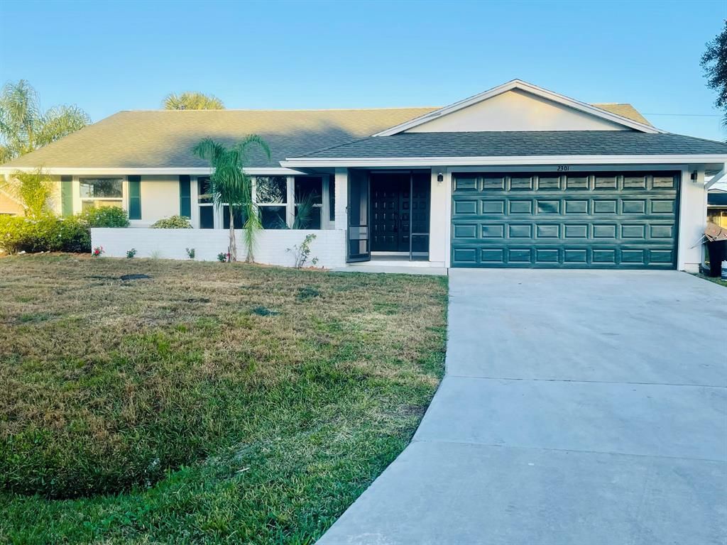 Photo of 2301 SW Freeman Street, Port Saint Lucie, FL 34953 (MLS # R10774563)