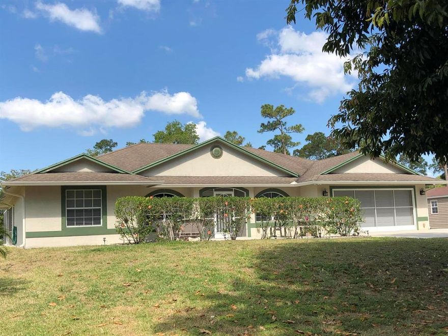 PRICE REDUCED,  3 BR + den, 2.5 BA, 2,900+ sq.ft, CBS Home w/ Solar heated, Chlorinated Salt water pool on 1+ acres in Jupiter Farms.  Home incl Gourmet Kitchen w/ granite counter, glass front cabinets & adjoining bay window-breakfast nook that overlooks pool.  Thoughtful upgrades incl: 11'x8' Butlers Pantry/Laundry room for extra storage & workspace, Crown molding w/ indirect lighting throughout living area; entry located den/office, 18' tile floors laid on diagonal throughout home, nested screen panels on garage door & screen door on garage side pedestrian door, making garage a cool, inviting workspace, 39'x15' patio overlooks pool; also adjacent to pool is 28'x11' orchid greenhouse w/ self-misting watering system.  Wonderful family home, on paved road w/ sidewalk in Jupiter Farms