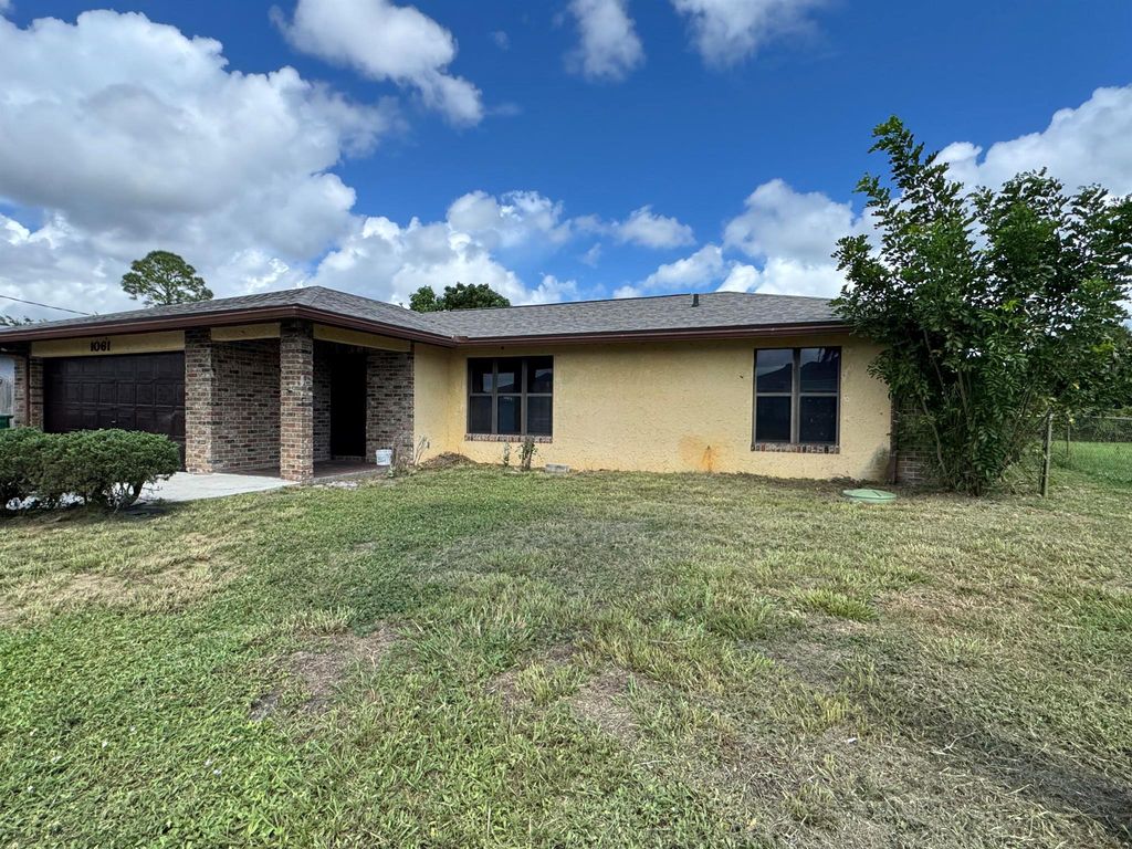 Photo of 1061 SE Lansdowne Avenue, Port Saint Lucie, FL 34983 (MLS # R11024058)