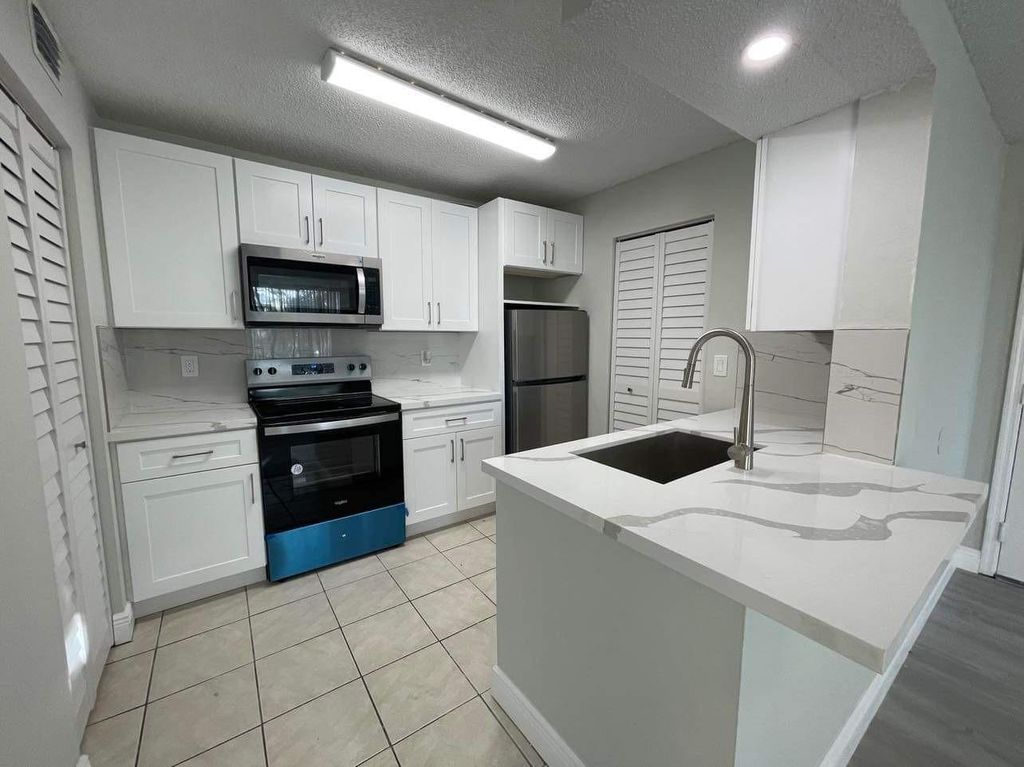 Photo of 4055 W Mcnab Rd #H208, Pompano Beach, FL 33069 (MLS # F10465446)