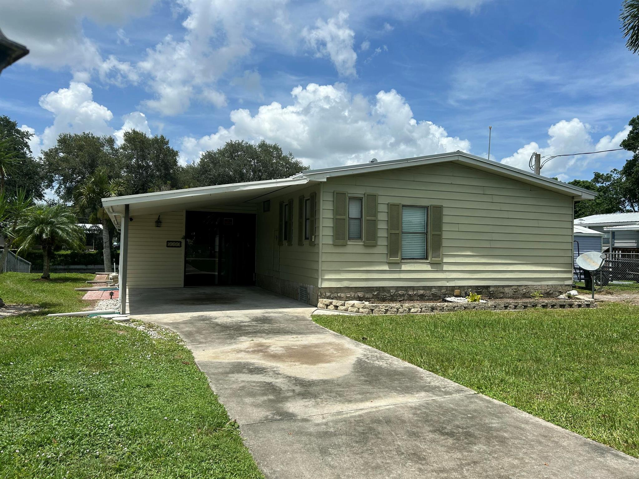 Waterfront 2-Bedroom, 2-Bath HomeDelight in the sunrise from your spacious, enclosed Florida room that offers stunning views of the water. This home comes with no HOA restrictions and features a newer metal roof along with a newer air conditioning unit.