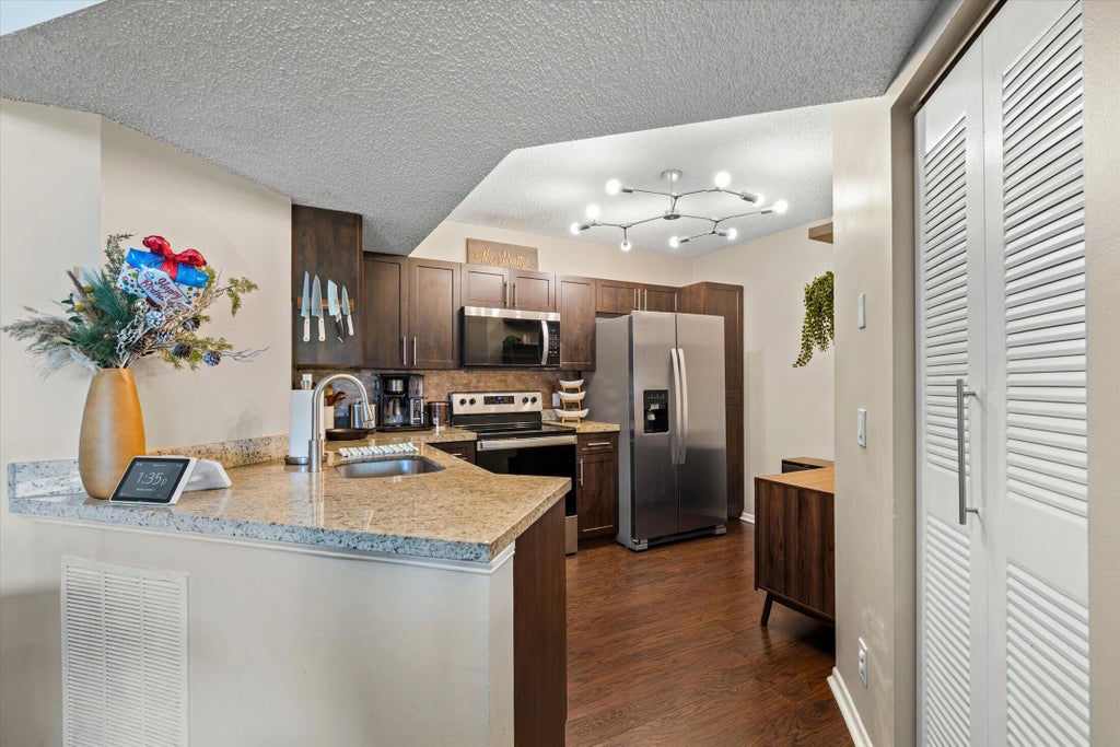 Photo of 8701 Wiles Road #306, Coral Springs, FL 33067 (MLS # B26089979)