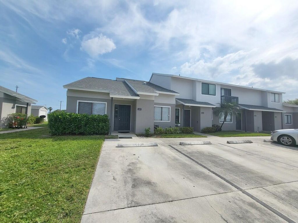 Photo of 1405 Wharf Lane, Greenacres, FL 33463 (MLS # R10974764)