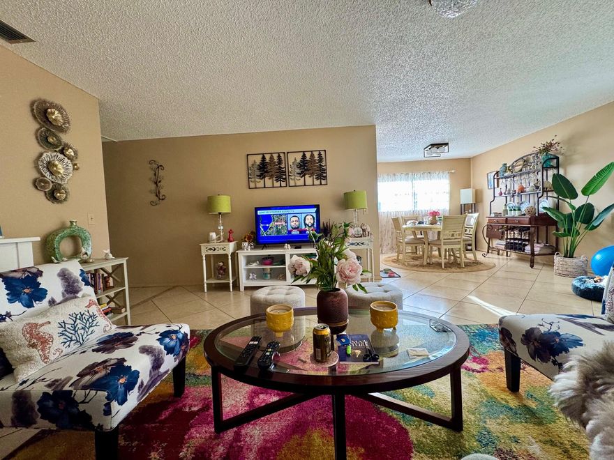 THROUGH THE ROOF VALUE! This super sharp, 2nd-floor corner unit in Vista St. Lucie is the definition of "Turn-Key." Fully furnished with high-end furniture, this 2BR/2BA home features a brand-new roof and a bright, open layout with high ceilings and tile throughout. The upgraded kitchen shines with granite countertops and breakfast bar, the master suite boasts a renovated bath with upscale tile and a custom walk-in shower. Relax on your large screened patio accessible from both bedrooms offering peaceful views of the preserve. Practicality meets luxury with Rolladen accordion shutters and low HOA  covers cable, internet, and building insurance. Enjoy active 55+ living with clubhouse, pool, gym & tennis/pickleball courts. Centrally located & easy to show!