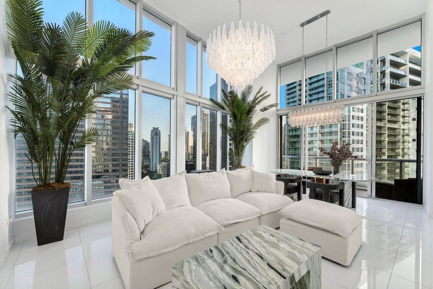 Experience the pinnacle of Miami luxury in this Icon Tower residence in the heart of Brickell. Rated a perfect 5 stars and awarded a guest favorite as one of the most loved homes on AirBnb with floor-to-ceiling windows frame skyline and bay views, while interiors are designed around the dream that was vintage Miami--blending timeless Art Deco elegance with modern sophistication. Features include a custom hand-cut tub, hand-blown crystal chandeliers, and access to resort-style amenities shared with the W Hotel. Steps from chic dining, nightlife, and designer shopping. Set on the 28th floor of The Icon Brickell, this unit boasts impressive high floor-to-ceiling windows, offering two private balconies showcasing partial water views and stunning cityscapes.  This is a MUST SEE!!