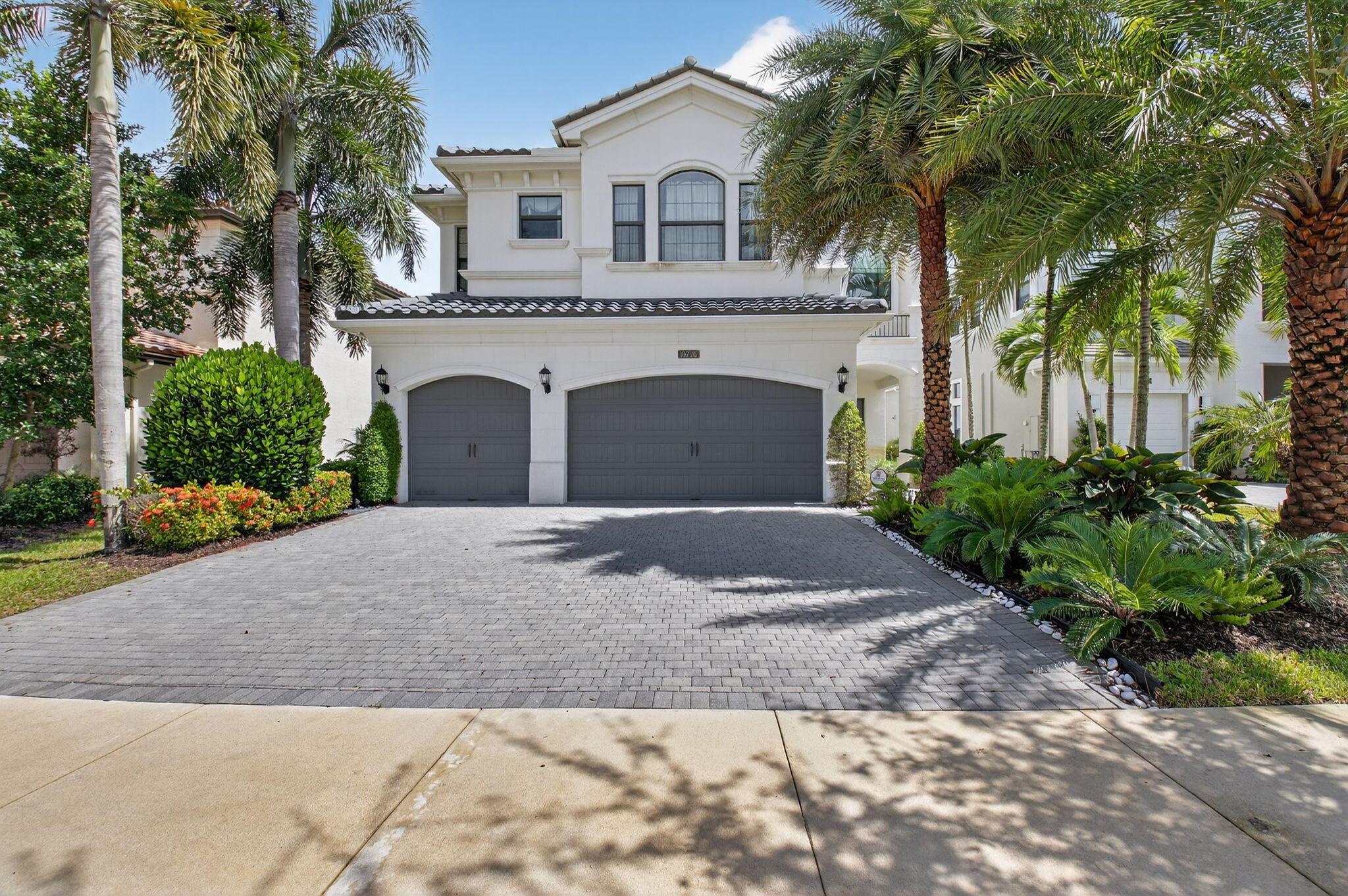 This designer-decorated model home is now available for rent. Situated on a premium lake front lot, fully furnished & turnkey. Featuring 5 spacious bedrooms, 5 luxurious bathrooms, a dedicated office & a large loft, this home is thoughtfully designed for both entertaining & everyday living. This impeccably maintained residence offers the perfect blend of elegance & comfort. Step outside to your private paradise-an unbelievable backyard with a resort-style pool, spa, & summer kitchen, surrounded by lush landscaping, a serene lake & stylish outdoor furnishings. Located in the prestigious Seven Bridges community, residents enjoy world-class amenities including a luxury clubhouse, dining, fitness center, tennis, pickleball, & more all in one of Boca Raton's most sought-after enclaves.