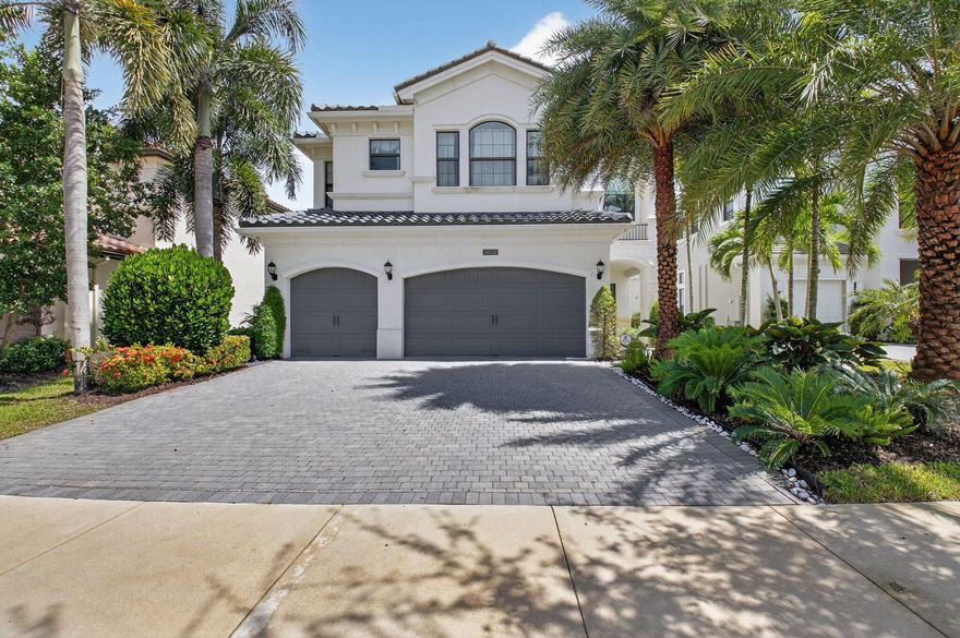 This designer-decorated model home is now available for rent. Situated on a premium lake front lot, fully furnished & turnkey. Featuring 5 spacious bedrooms, 5 luxurious bathrooms, a dedicated office & a large loft, this home is thoughtfully designed for both entertaining & everyday living. This impeccably maintained residence offers the perfect blend of elegance & comfort. Step outside to your private paradise-an unbelievable backyard with a resort-style pool, spa, & summer kitchen, surrounded by lush landscaping, a serene lake & stylish outdoor furnishings. Located in the prestigious Seven Bridges community, residents enjoy world-class amenities including a luxury clubhouse, dining, fitness center, tennis, pickleball, & more all in one of Boca Raton's most sought-after enclaves.